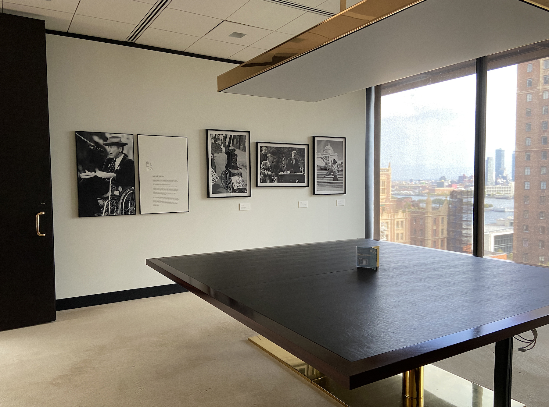 Conference room overlooking the city, Tom Olin photos on the wall