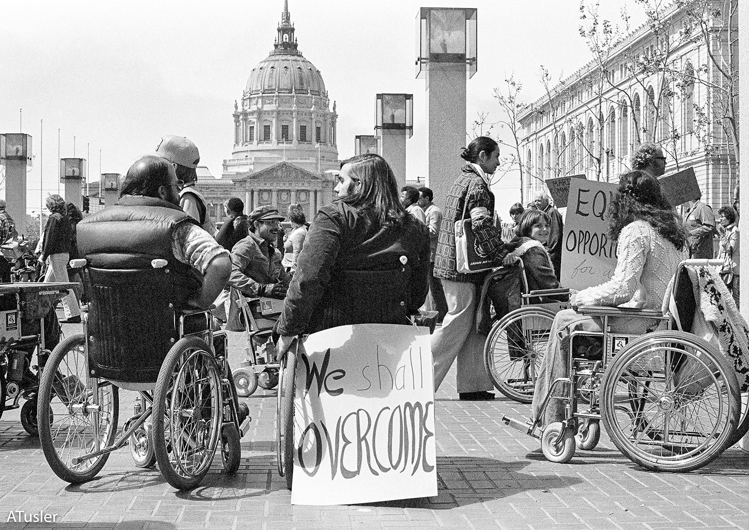 Black and white photo of crowd in front of a rotunda building