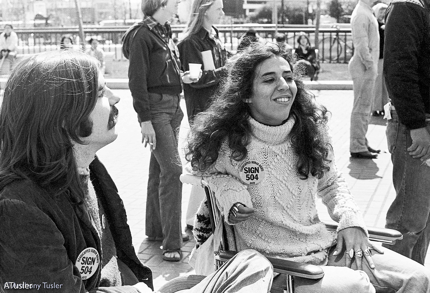 Black and white photo of two people smiling