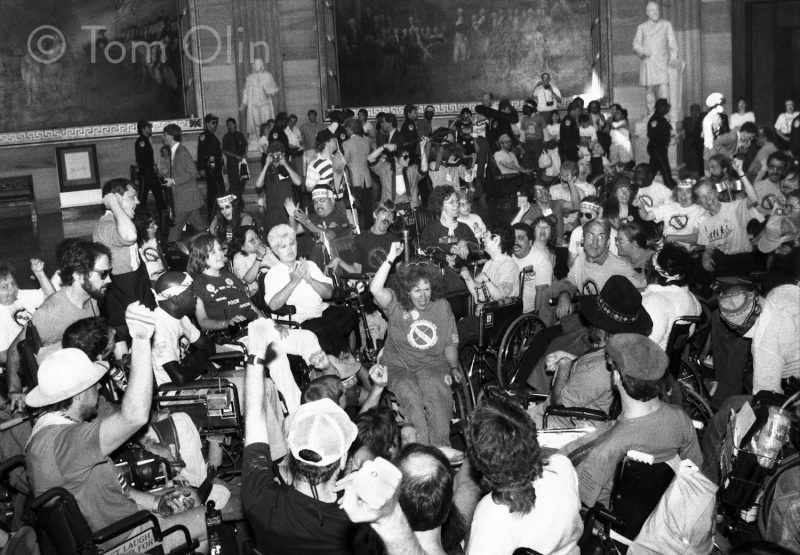 Back and white photo of hunderds of protesters in the Rotunda of the U.S. Capitol